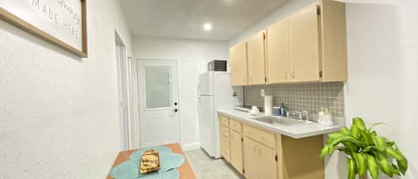 Fridge, microwave, stovetop, coffee/tea maker