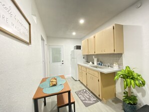Fridge, microwave, stovetop, coffee/tea maker