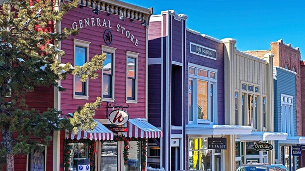A row of vintage storefronts with a General Store, a flight boutique, and an Overland store. - Cozy 2BD/2BA Mountain View Condo, near skiing, Sleeps 4+ (Park City)