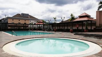 Outdoor pool, open 7:00 AM to 7:00 PM, pool loungers