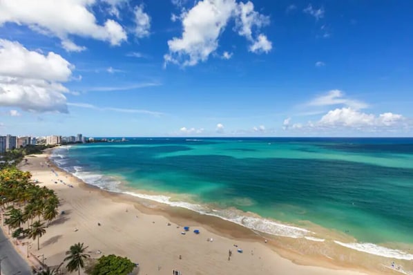 On the beach, sun-loungers, beach towels