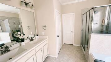 Bathtub, hair dryer, towels, soap