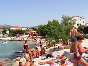 Guests can enjoy swimming, sunbathing, and walking along the beach.