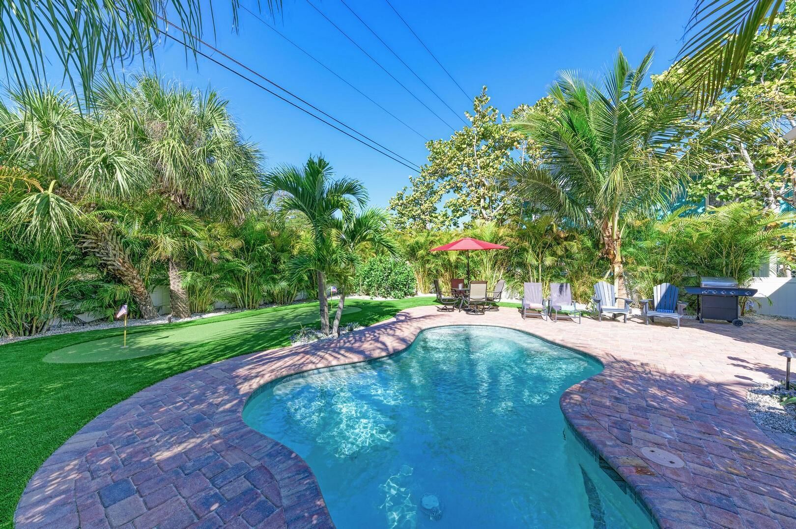 A heated pool, pool loungers