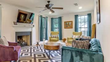 TV, fireplace, books