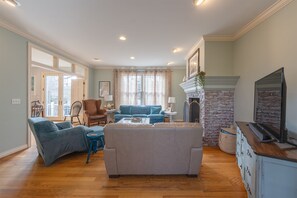 Smart TV, fireplace, table football, books