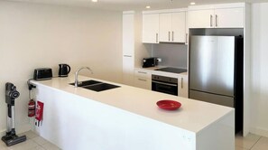 Fridge, microwave, oven, stovetop - “Callington” Darwin City High-Rise (Darwin City)