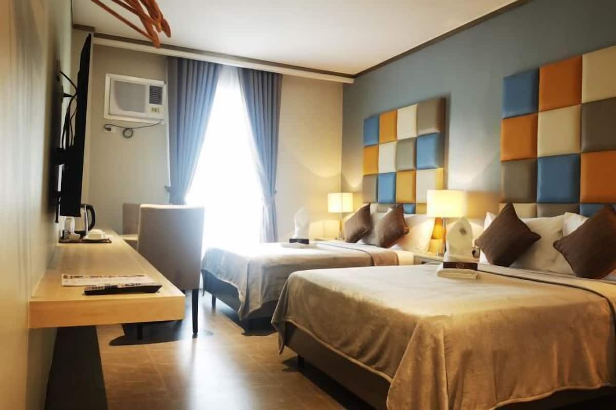 Premium bedding, desk, laptop workspace, free WiFi