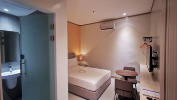Premium bedding, desk, laptop workspace, free WiFi