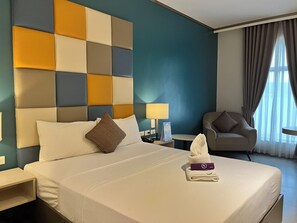 A hotel room with a bed, a nightstand, a chair, a lamp, and a window with curtains. - Yes Hotel Pandi Bulacan (Pandi)