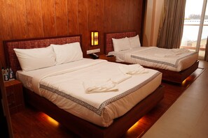 Premium Quadruple Room | Bed sheets - Mansha Palace (Port Blair)