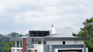 A modern building with a prominent sign reading "MANSHA RALLE". - Mansha Palace (Port Blair)