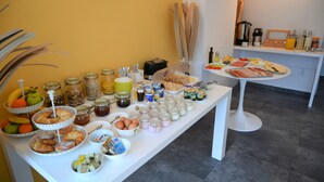 A buffet table with various food items and condiments. - B&B Boutique Eluize Dubrovnik (Dubrovnik)