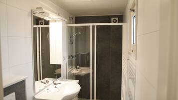 Shower, towels, toilet paper