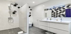 A modern bathroom with a shower, toilet, and dual sinks. - Top of the range in Montrogueil -330sqm 5br family villa-sensational! (Paris)