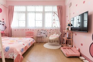 A pink-themed bedroom with a bed, a hanging chair, a small table, and a TV. - moon walks slowly (Tainan)
