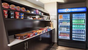 A snack bar with various food items and a Pepsi refrigerator. - La Quinta Inn & Suites by Wyndham Wenatchee (Wenatchee)