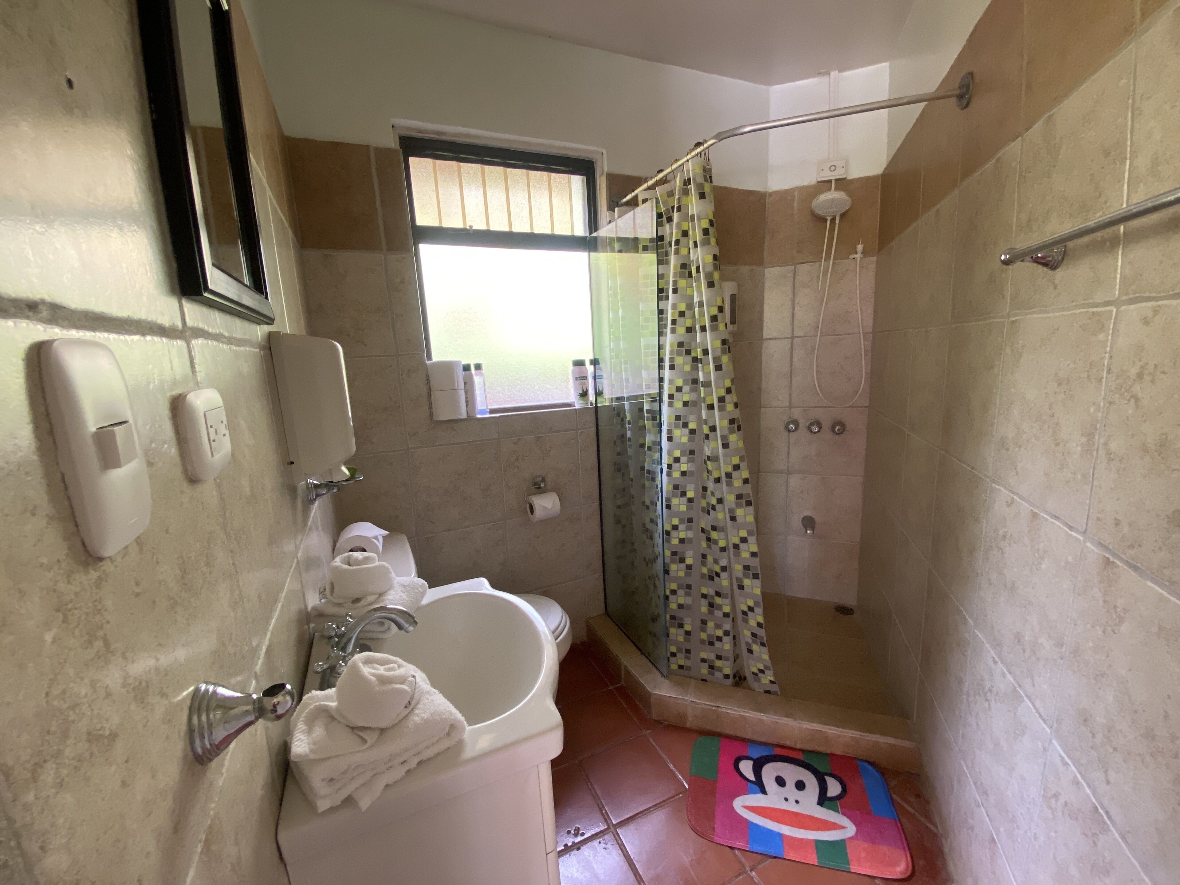 deluxe quadruple room, 2 queen beds, non smoking | bathroom | bathtub, towels