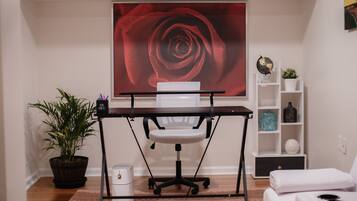 Work in comfort with a desk, chair, and ample space for productivity.