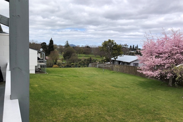 Front expanse of lawn leading to jetty