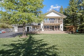 A two-story house with a front porch and a garage.