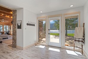 A spacious living area with a large sliding glass door leading to an outdoor patio.