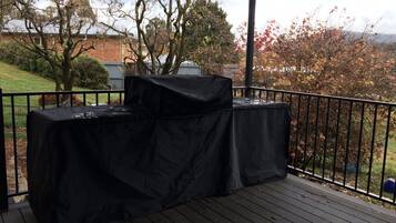 Enjoy al fresco dining on this outdoor deck with a barbecue station and scenic views of the surrounding neighborhood.