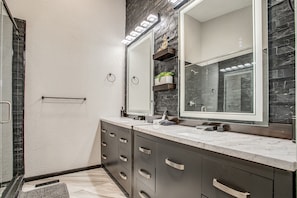 Combined shower/tub, hair dryer, towels, soap