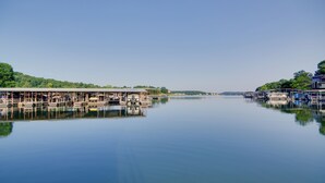 A marina with docked boats and a clear sky. - Pool & Lake Access! 3rd-Floor Osage Beach Retreat (Osage Beach)