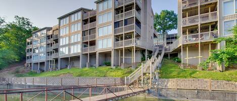 A multi-story building with balconies and a staircase leading to the upper levels.