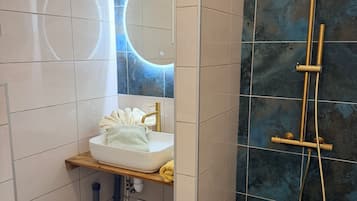 Shower, hair dryer, towels, soap