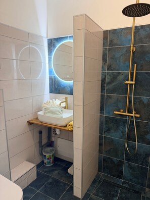Shower, hair dryer, towels, soap