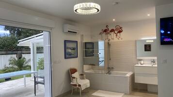 Bathtub, hair dryer, towels, soap