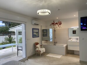 Bathtub, hair dryer, towels, soap