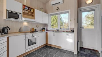 Fridge, stovetop, dishwasher, coffee/tea maker