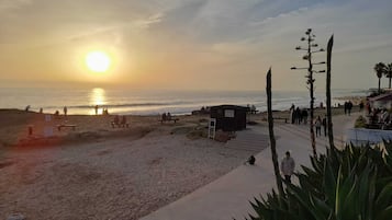 On the beach, sun loungers, beach towels