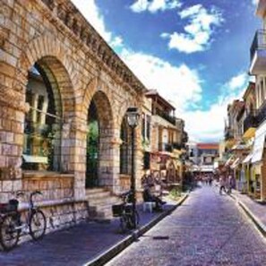 A cobblestone street with stone buildings, a bicycle, and a clear blue sky. - Eva's House 2 Bedroom Apartment in Rethymno (Rethymno)