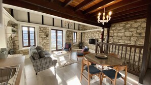 Design House | Living area | 42-inch LCD TV with digital channels, TV, fireplace - Leonys House by TrulyCyprus (Dhoros)