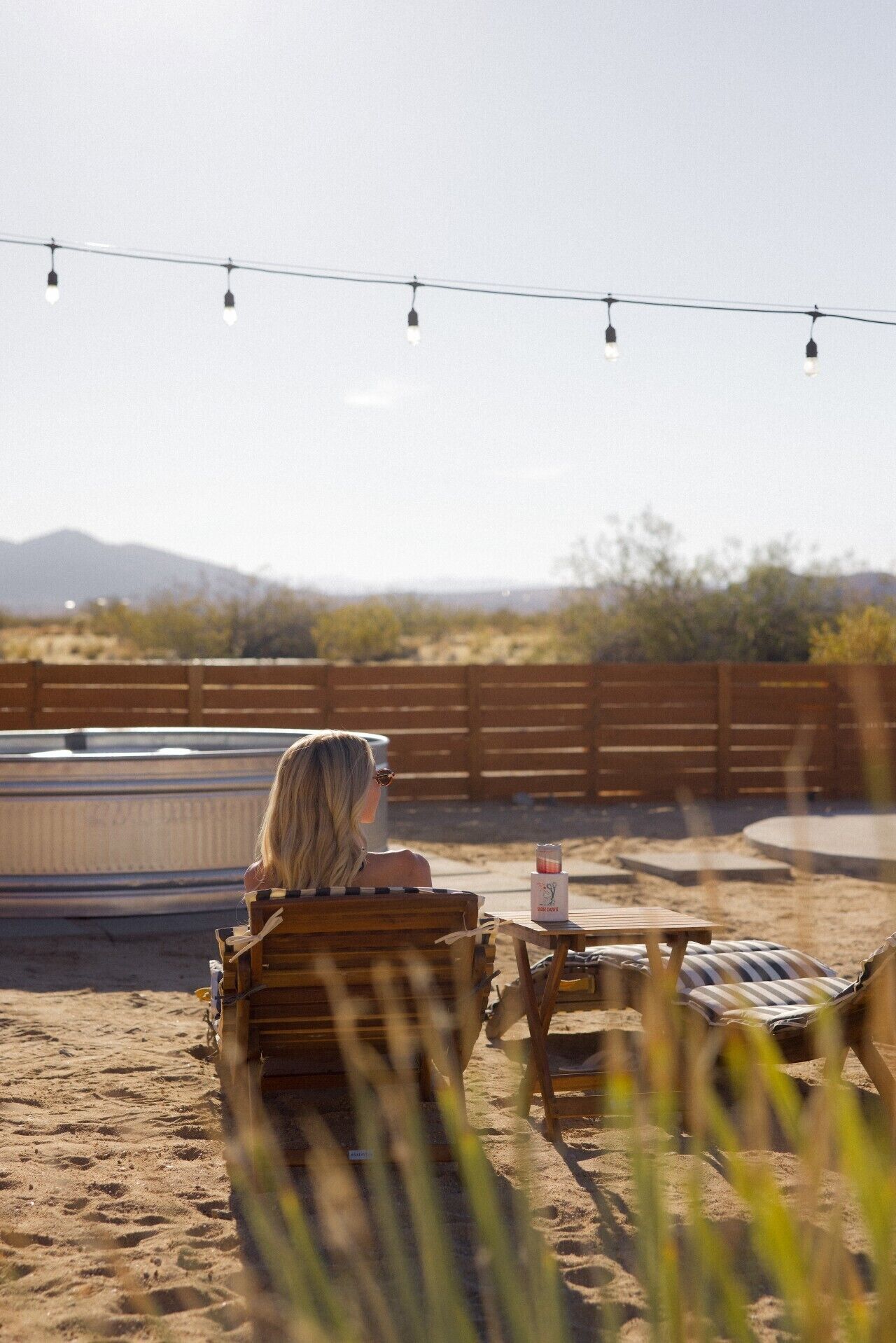 Lounge chairs overlooking the desert + pool
