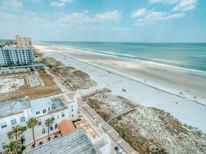 On the beach, sun loungers, beach towels - Ocean Front Condo w/ beach access and pool (Jacksonville Beach)