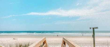 On the beach, sun loungers, beach towels