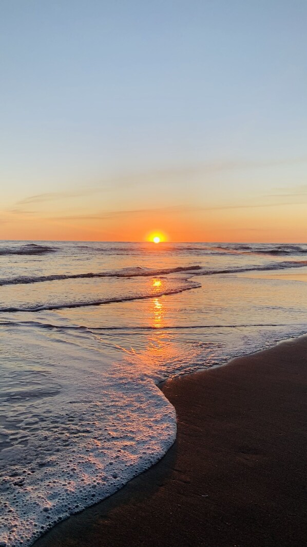 On the beach, sun loungers