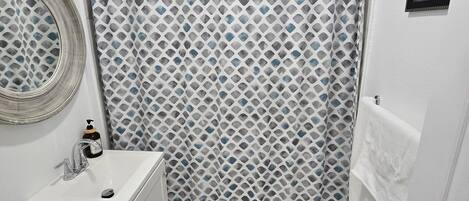 Combined shower/tub, hair dryer, towels, soap