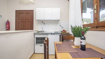 Fridge, stovetop, toaster, cookware/dishes/utensils