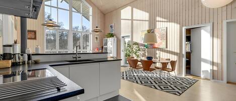 Fridge, stovetop, dishwasher, coffee/tea maker