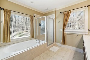 Bathtub, jetted bath, hair dryer, towels
