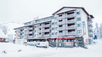 A multi-story hotel with balconies, a restaurant, and a spa.