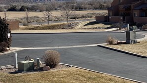 A parking lot with a view of snow-capped mountains in the background. - New!  Beautiful, secluded views 10 minutes from Downtown Moab!  (Moab)