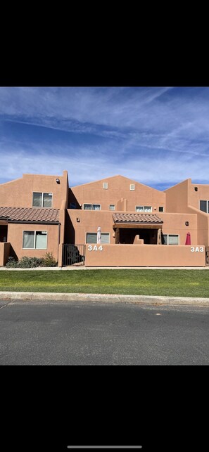 A row of modern, tan-colored buildings with numbered units 3A4 and 3A3. - New! Beautiful, secluded views 10 minutes from Downtown Moab! (Moab)