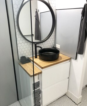 Shower, hair dryer, towels, soap